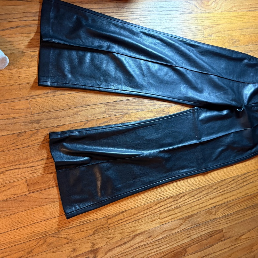Black faux leather flare pants. Perfect for New Years Eve.